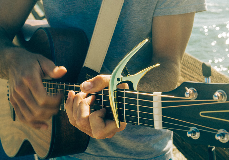 Playing guitar with a capo